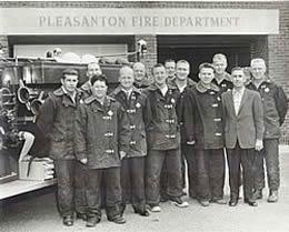 Resident Bob Juniper in his younger years standing in front of the Pleasanton Fire Department with all his fellow firemen.