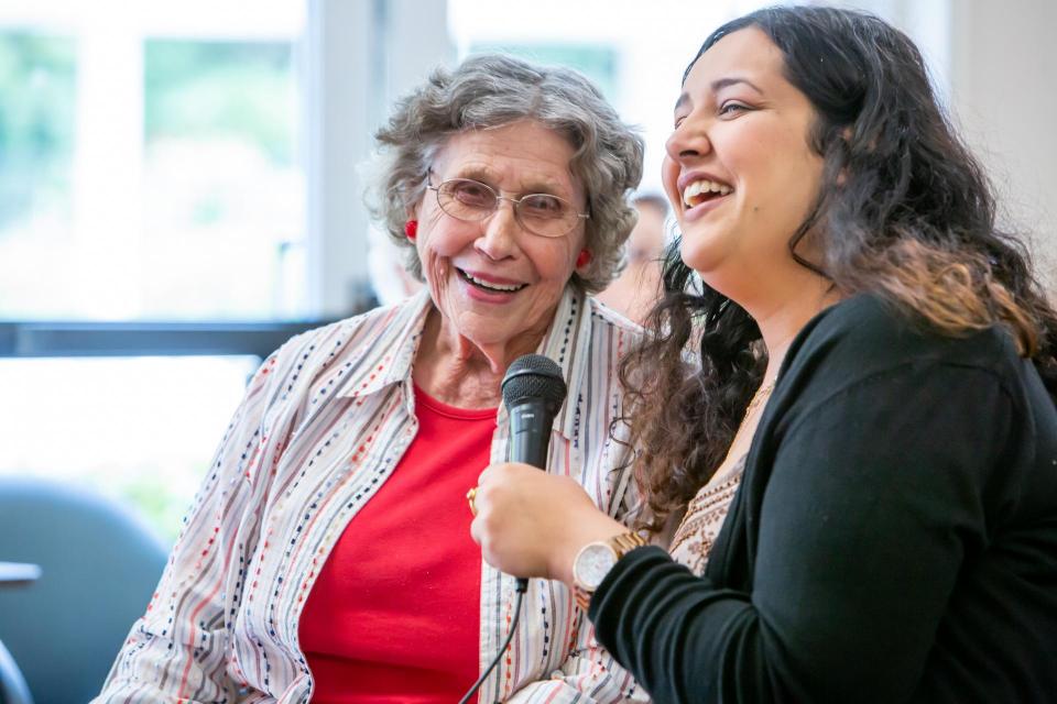 Older adult with and Singer with microphone at Gold River