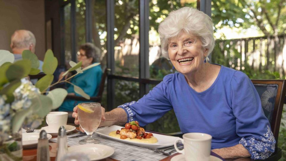 Resident eating lunch at table