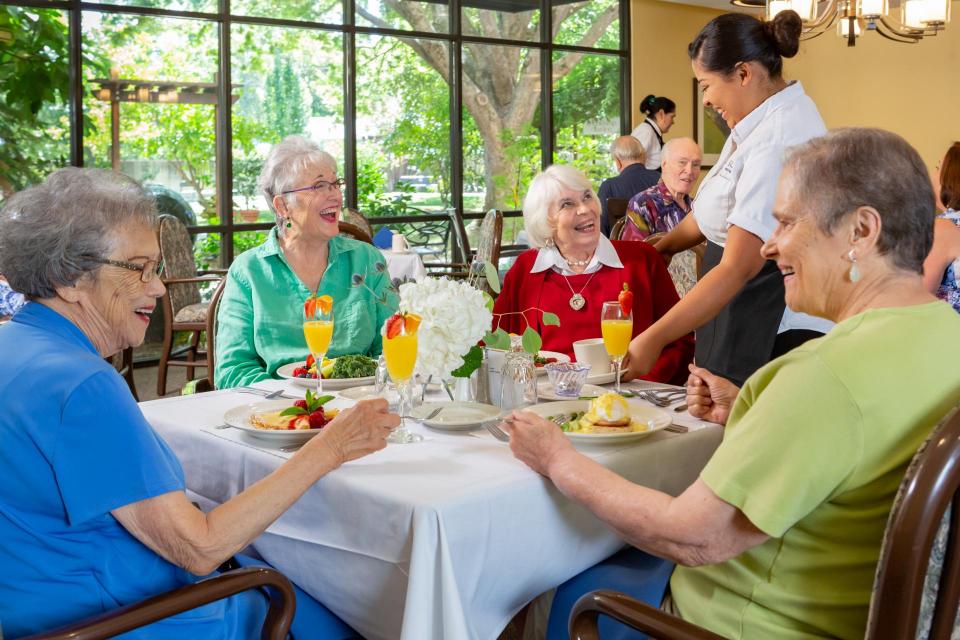 Residents eating dining in the dining room